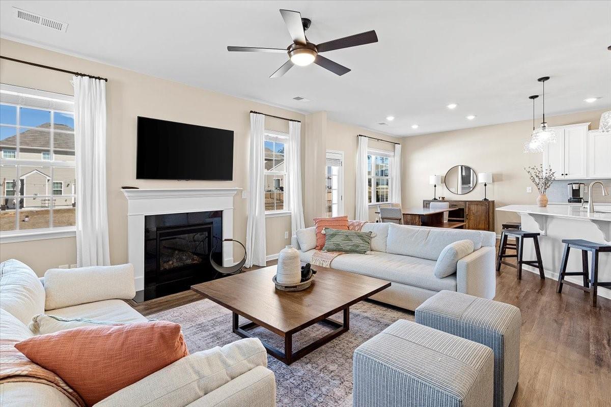 7730 Sea Turtle Way Lancaster, SC 29720 - Photo 2 of 24 a living room with furniture fireplace and a flat screen tv