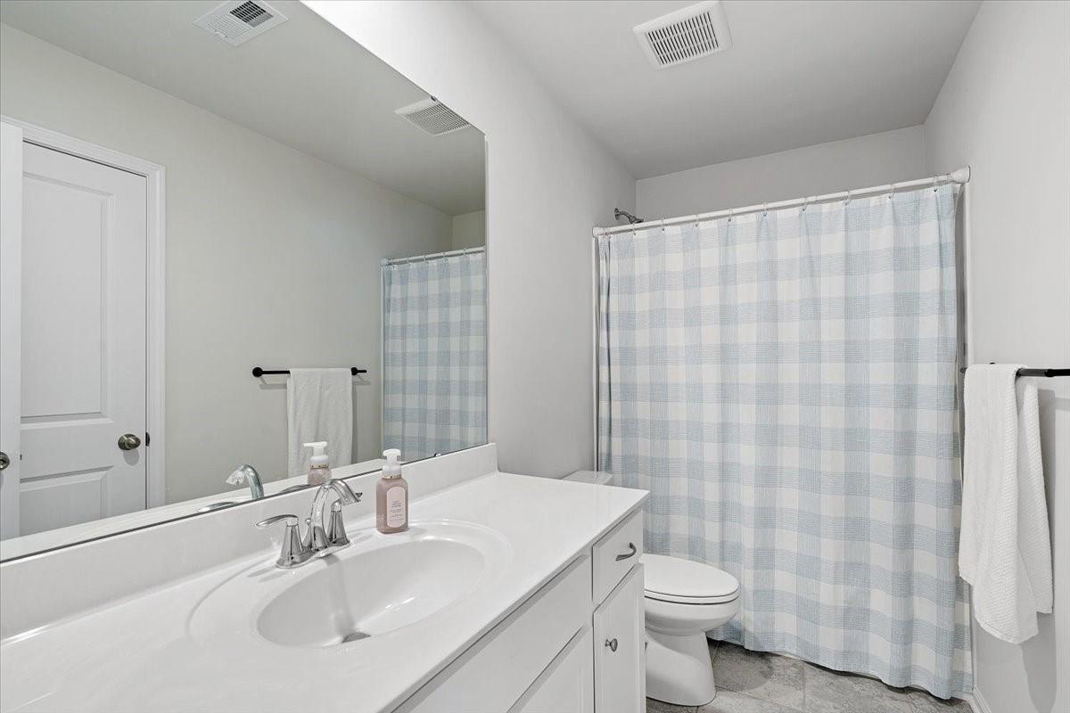 7730 Sea Turtle Way Lancaster, SC 29720 - Photo 21 of 24 a bathroom with a sink toilet and shower