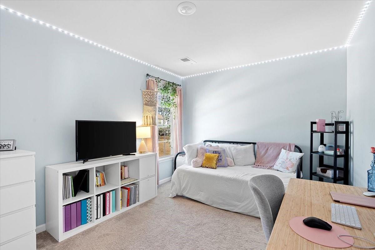7730 Sea Turtle Way Lancaster, SC 29720 - Photo 22 of 24 a living room with a couch and a flat screen tv