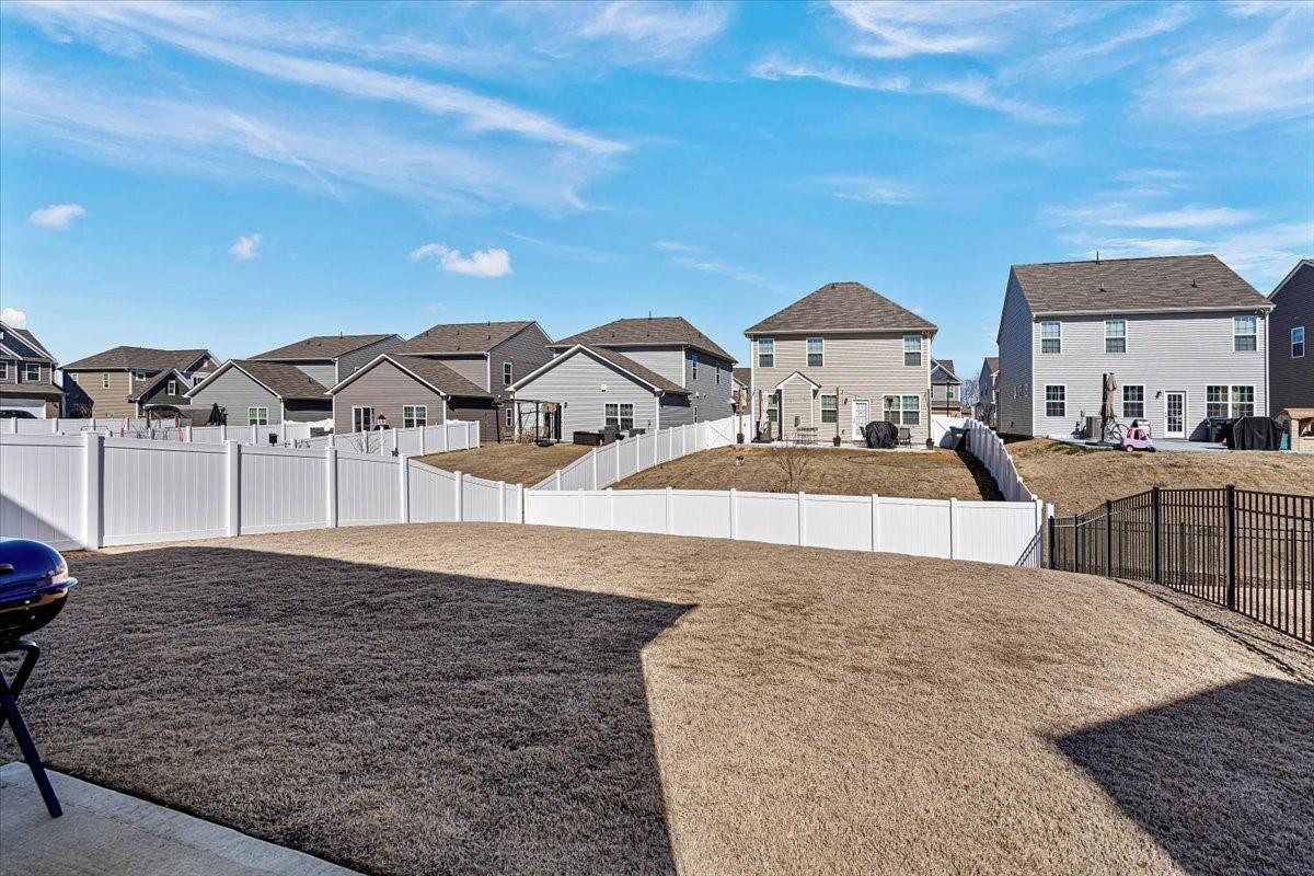7730 Sea Turtle Way Lancaster, SC 29720 - Photo 24 of 24 a living room with furniture and a lamp
