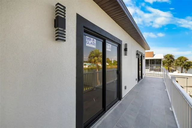 a view of a balcony with wooden floor
