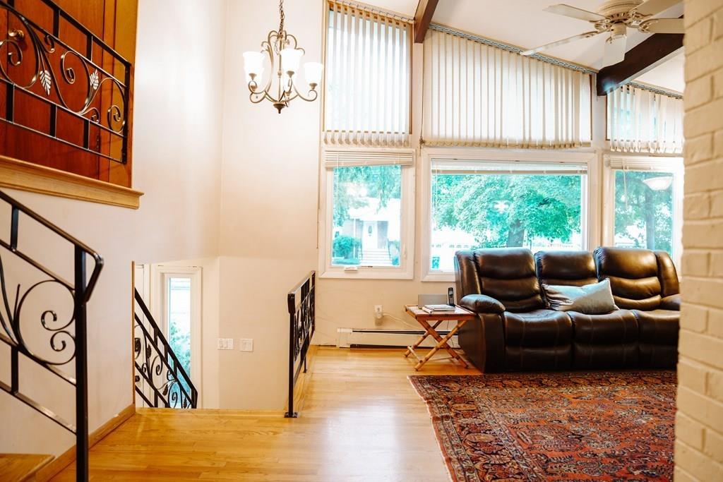 17 Brandeis Road Newton, MA 02459 - Photo 4 of 24 a living room with furniture and a large window