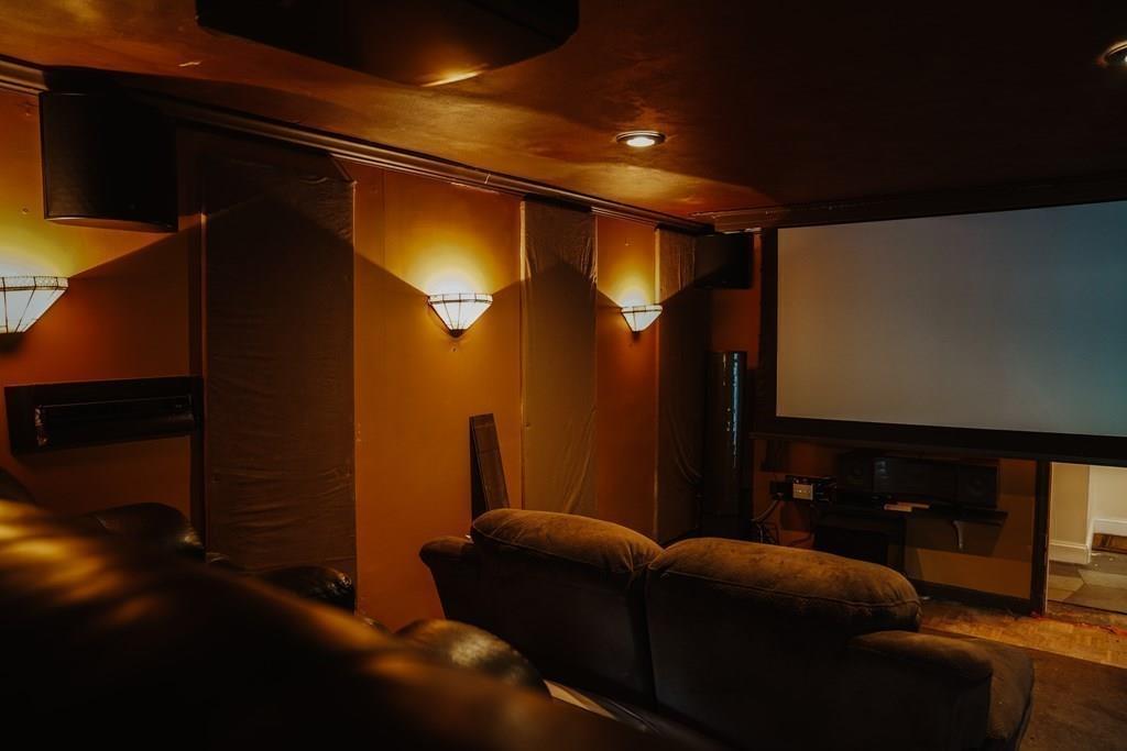 17 Brandeis Road Newton, MA 02459 - Photo 5 of 24 a living room with furniture and a projector screen