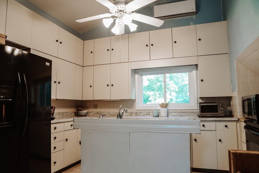 17 Brandeis Road Newton, MA 02459 - Photo 8 of 24 a kitchen with appliances cabinets and a window