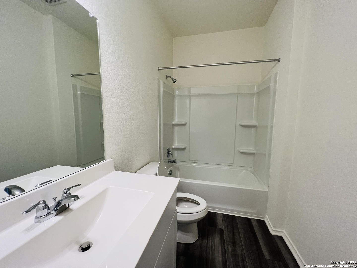 8907 Colony Meadow Converse, TX 78109 - Photo 14 of 31 a bathroom with a bathtub shower sink vanity and a toilet