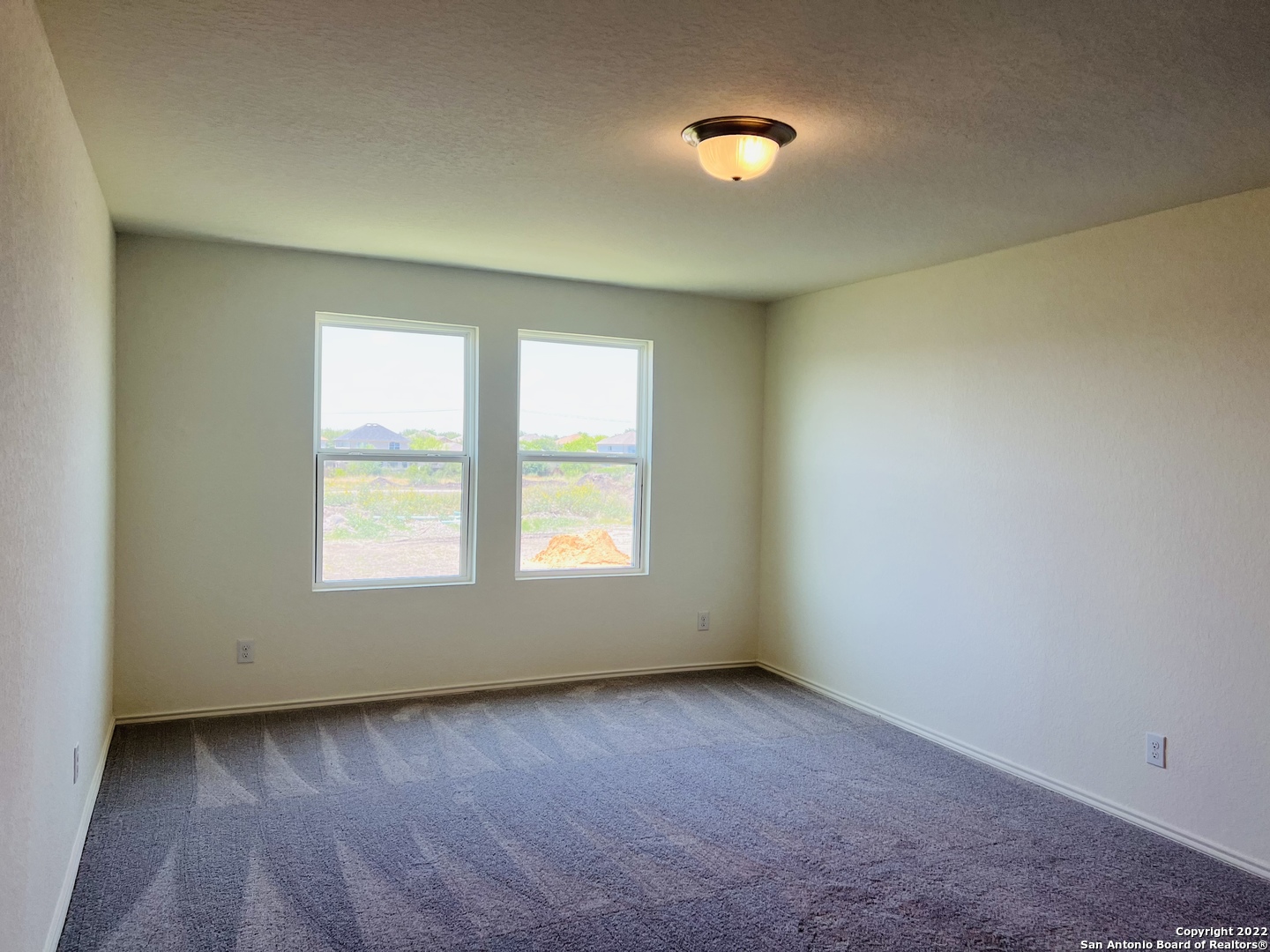 8907 Colony Meadow Converse, TX 78109 - Photo 20 of 31 an empty room with windows