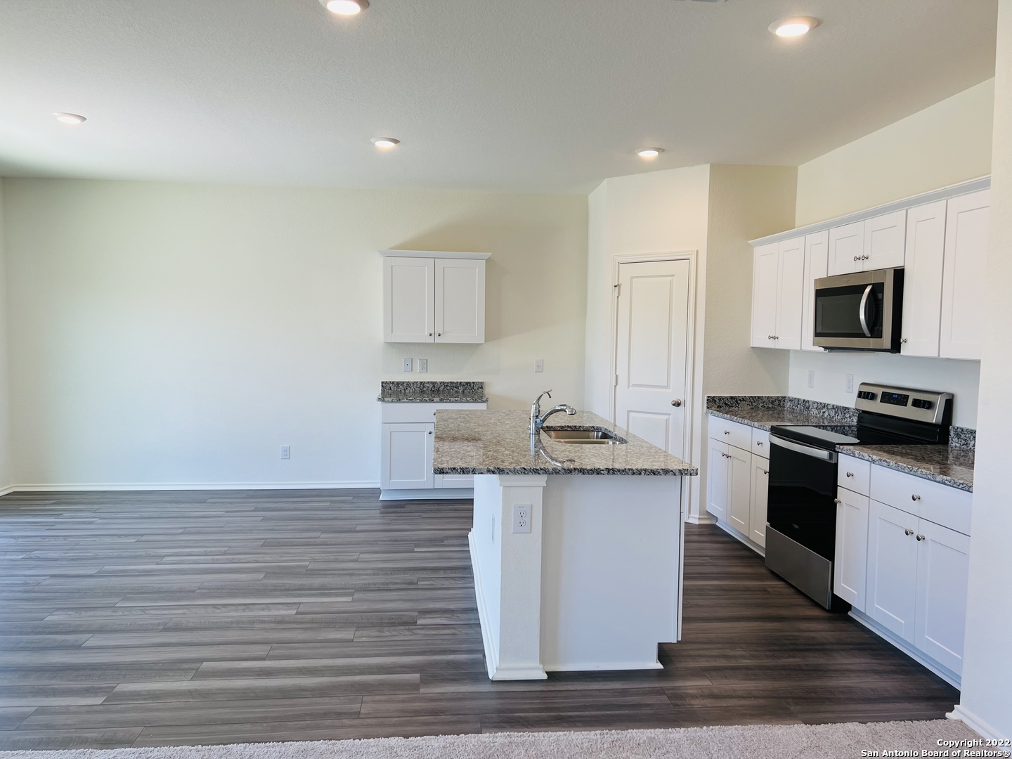 8907 Colony Meadow Converse, TX 78109 - Photo 2 of 31 a kitchen with a sink and stainless steel appliances