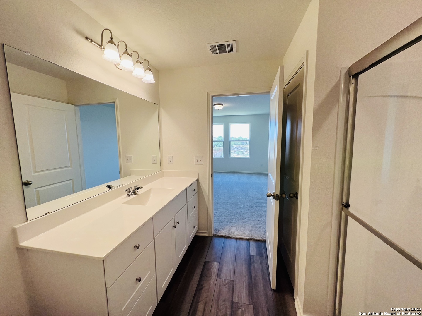 8907 Colony Meadow Converse, TX 78109 - Photo 23 of 31 a bathroom with a double vanity sink and mirror