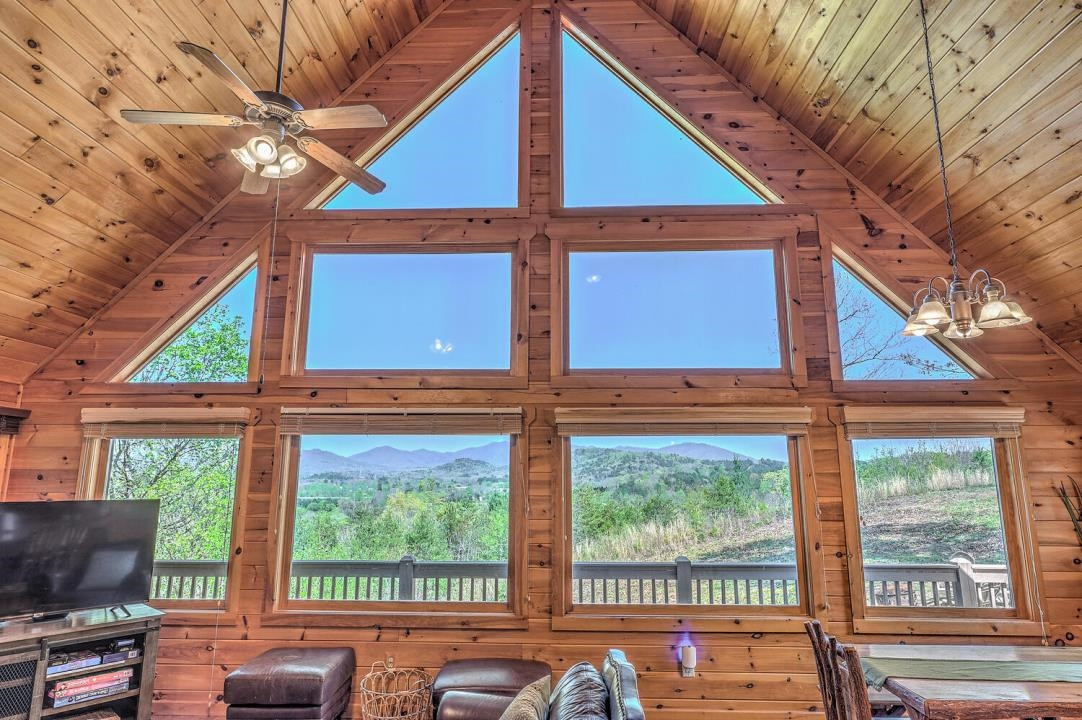 398 Pin Oak Road Murphy, NC 28906 - Photo 18 of 30 a view of a balcony with furniture and floor to ceiling windows