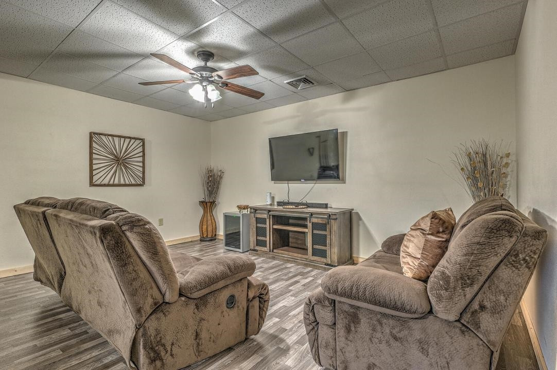 398 Pin Oak Road Murphy, NC 28906 - Photo 21 of 30 a living room with furniture and a flat screen tv