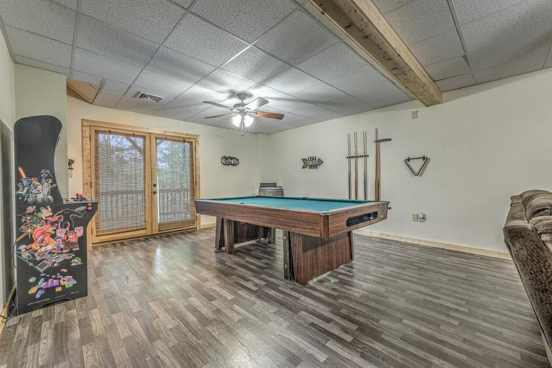 398 Pin Oak Road Murphy, NC 28906 - Photo 23 of 30 a room with furniture a chandelier and wooden floor