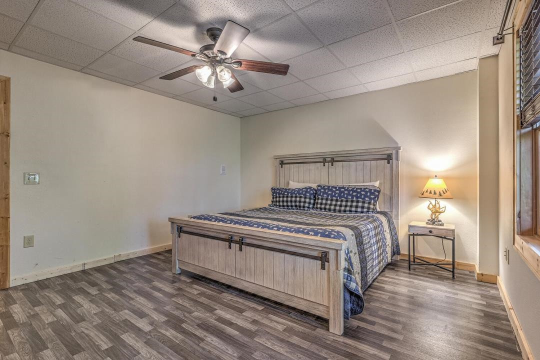398 Pin Oak Road Murphy, NC 28906 - Photo 28 of 30 a bedroom with a bed and a chandelier