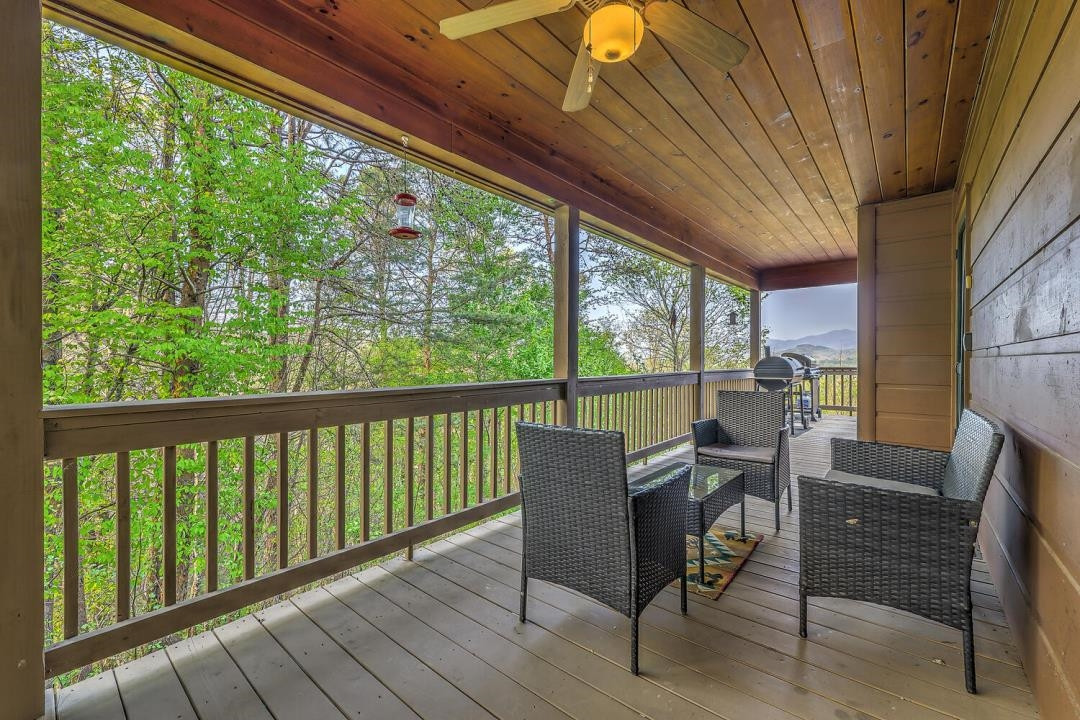 398 Pin Oak Road Murphy, NC 28906 - Photo 9 of 30 a view of a porch with furniture and wooden floor