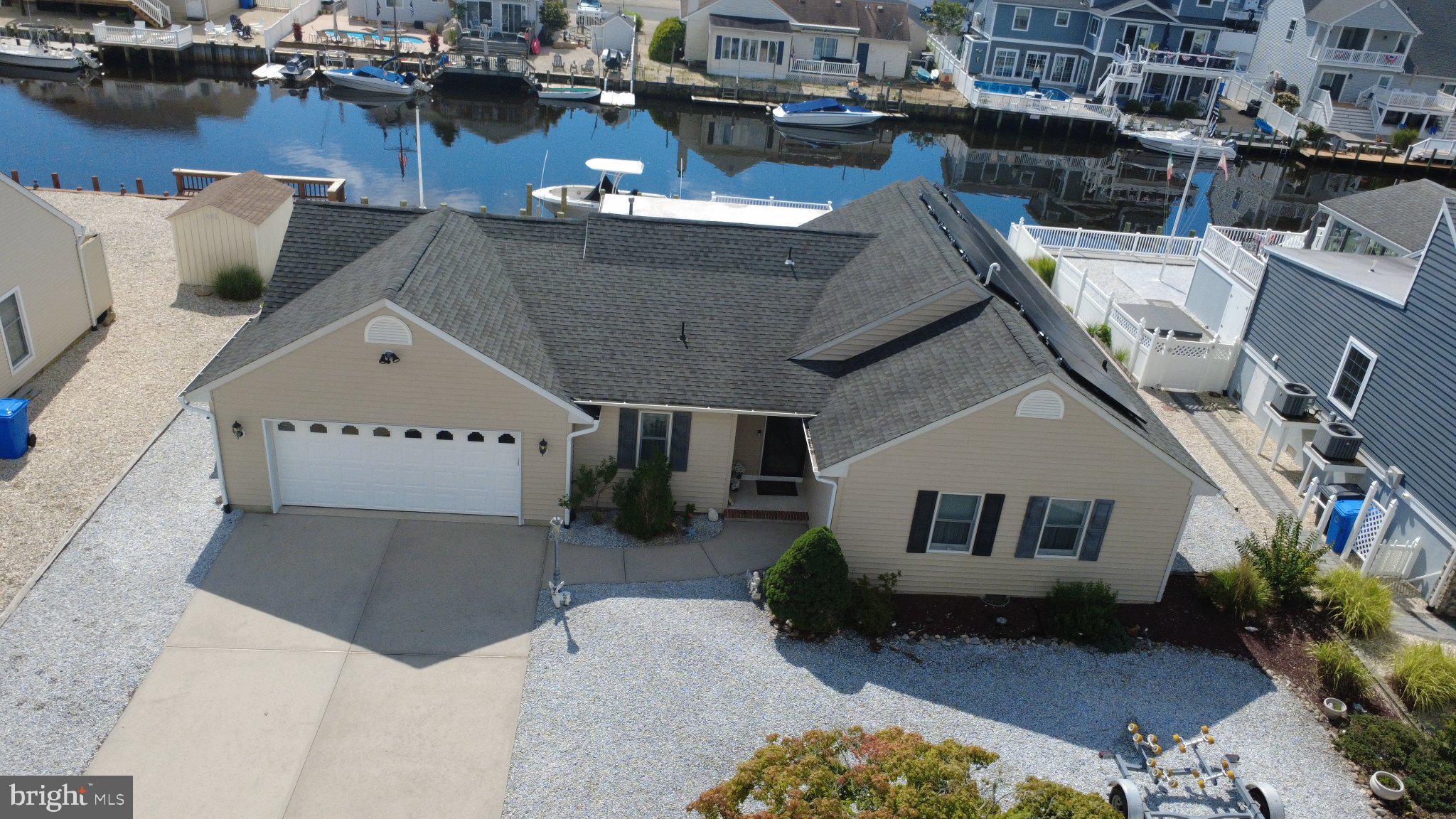 211 William Cook Boulevard Manahawkin, NJ 08050 - Photo 1 of 71 Charming waterfront home with serene views.