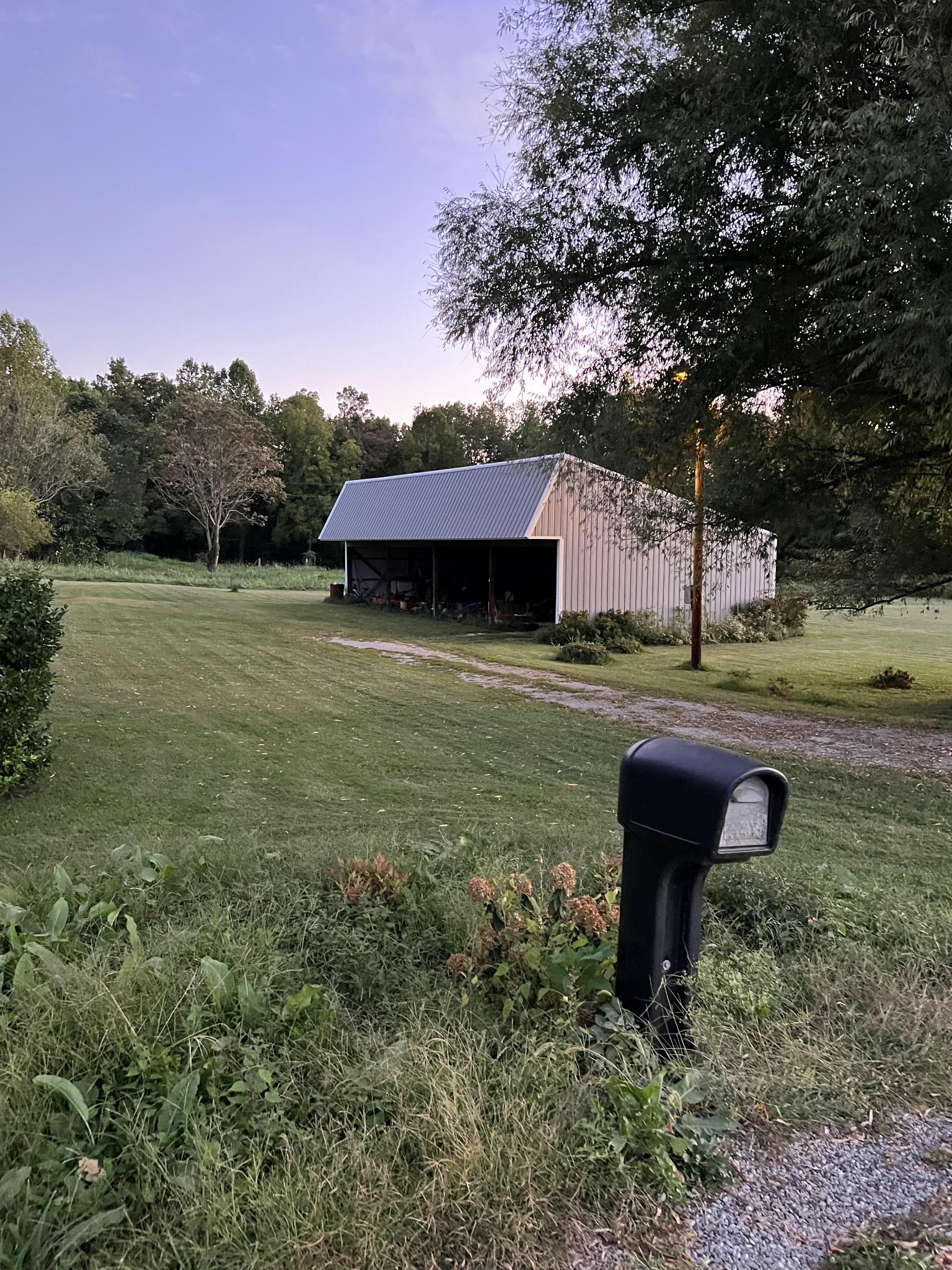 228 George Reeder Road Monroe, TN 38573 - Photo 2 of 3 a backyard of a house with table and chairs