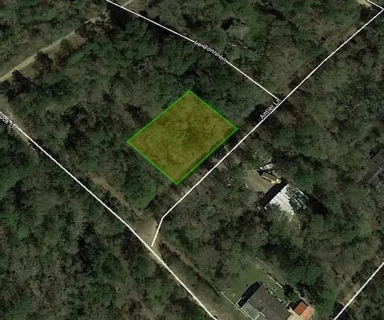 a aerial view of a house with a street