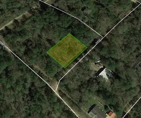 a aerial view of a house with a street