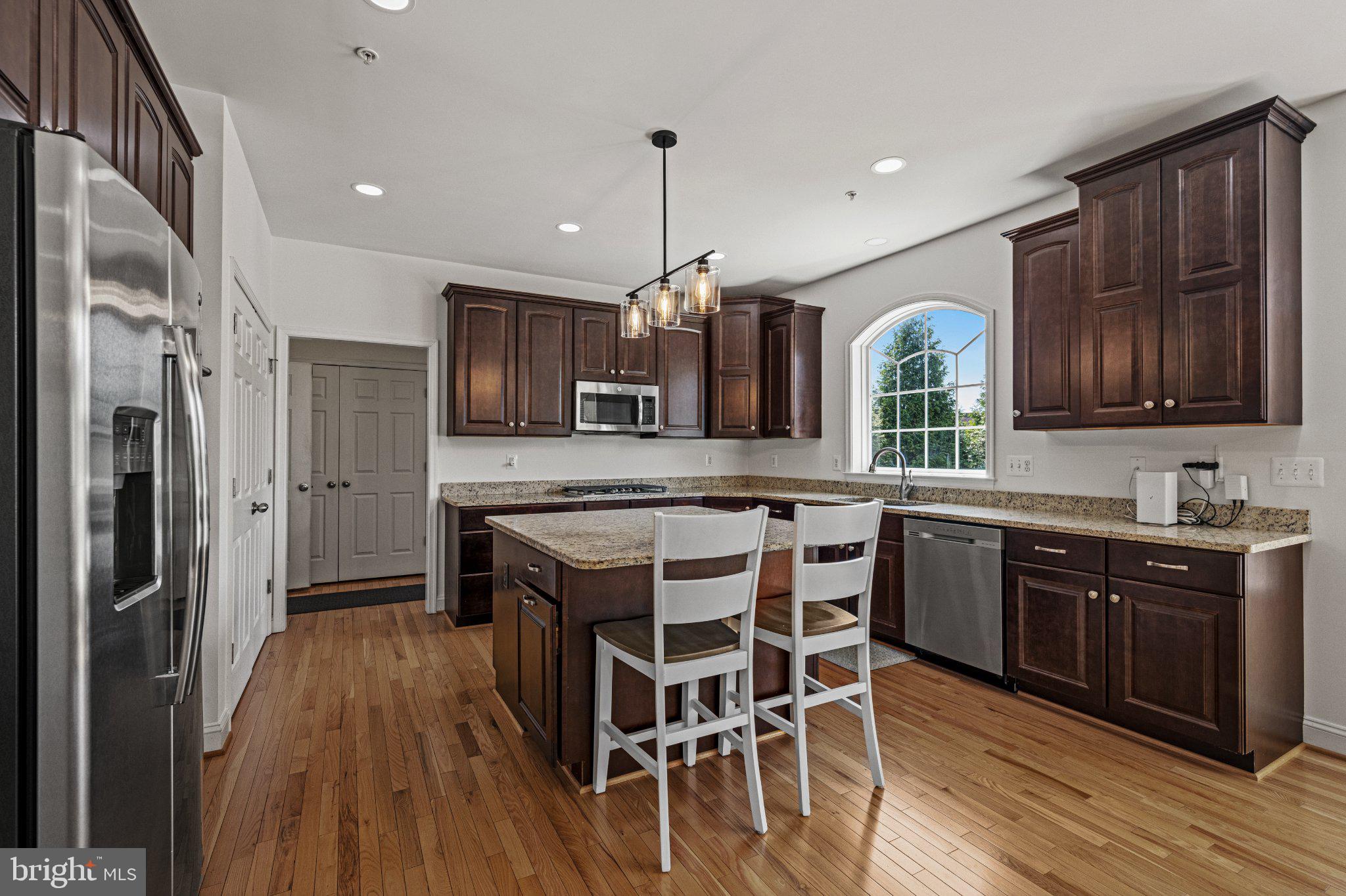 10693 Harding Road Laurel, MD 20723 - Photo 16 of 55 Modern kitchen with rich cabinetry.