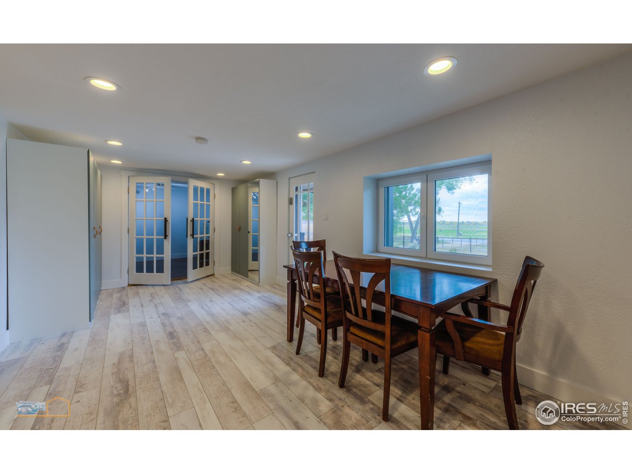 8155 Hygiene Road Longmont, CO 80503 - Photo 13 of 40 a view of a dining room with furniture and wooden floor