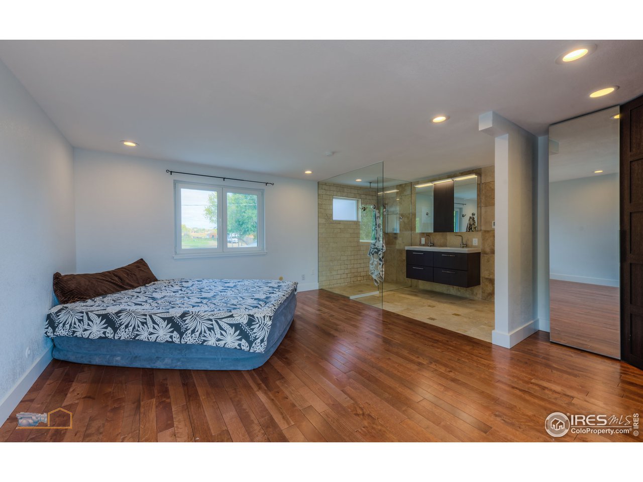 8155 Hygiene Road Longmont, CO 80503 - Photo 15 of 40 a living room with furniture and a wooden floor