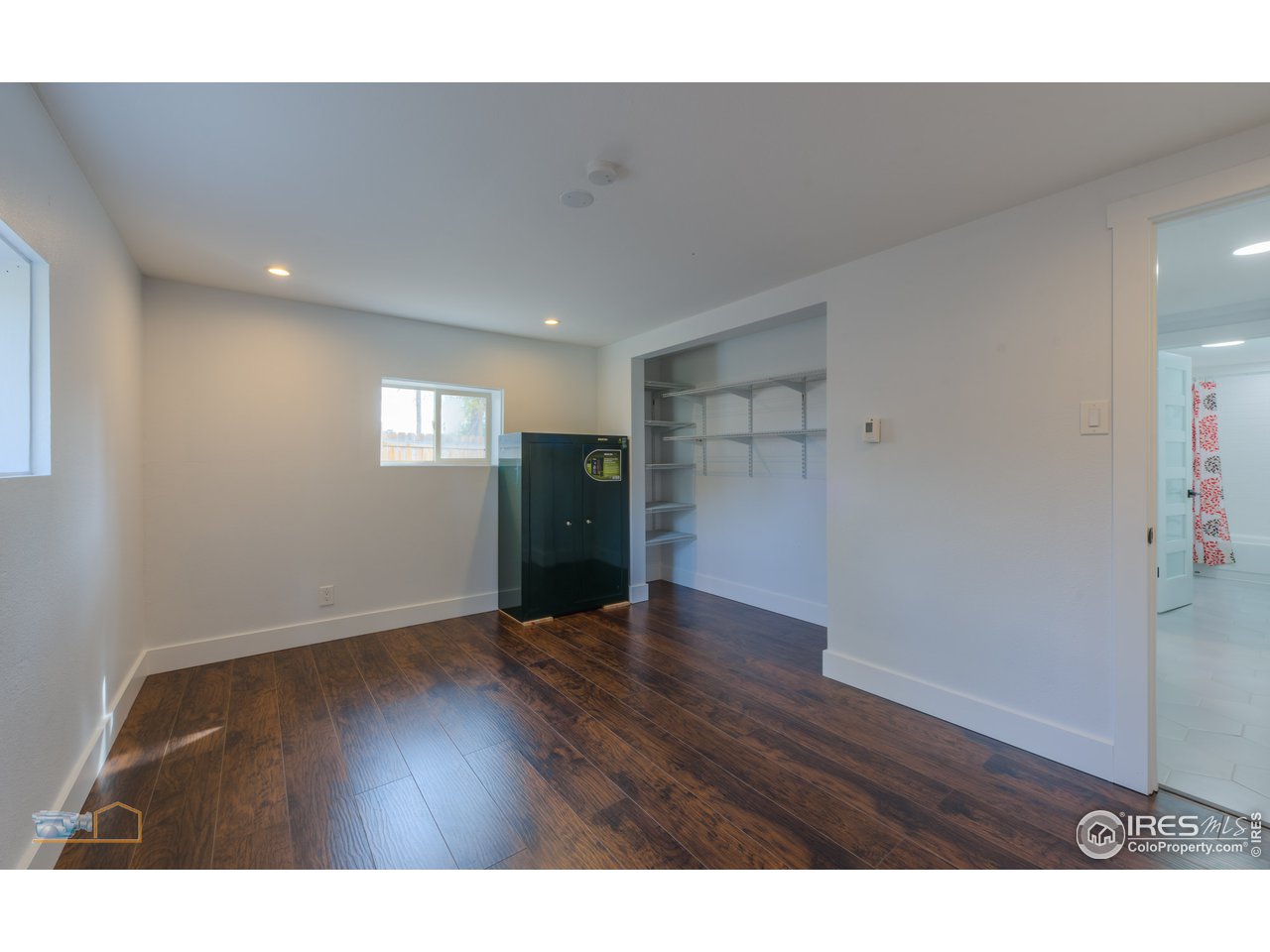 8155 Hygiene Road Longmont, CO 80503 - Photo 19 of 40 a view of an empty room and wooden floor