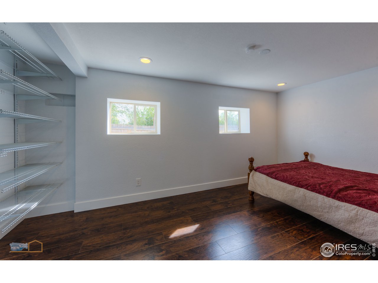 8155 Hygiene Road Longmont, CO 80503 - Photo 21 of 40 a bedroom with a bed and a window