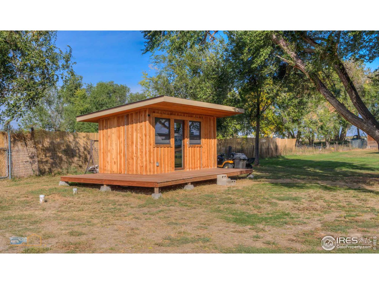 8155 Hygiene Road Longmont, CO 80503 - Photo 25 of 40 a view of a house with backyard swimming pool and sitting area