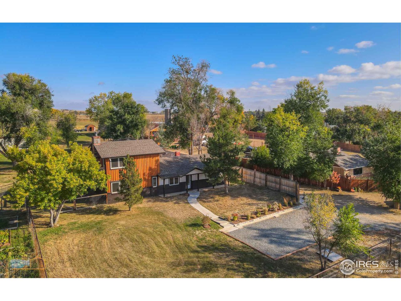 8155 Hygiene Road Longmont, CO 80503 - Photo 3 of 40 a view of a swimming pool with an outdoor space and seating area