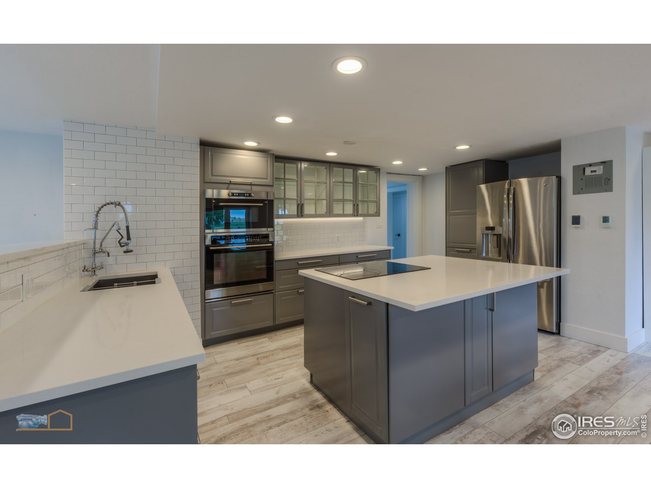 8155 Hygiene Road Longmont, CO 80503 - Photo 10 of 40 a kitchen with stainless steel appliances granite countertop a sink a stove and a refrigerator
