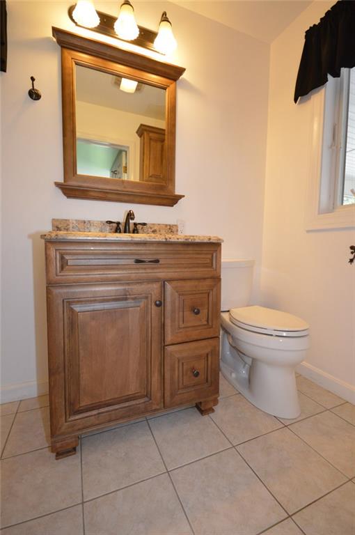 2610 Pulaski Road New Castle, PA 16105 - Photo 12 of 25 Master bath has an updated vanity with granite counter and tile floor.