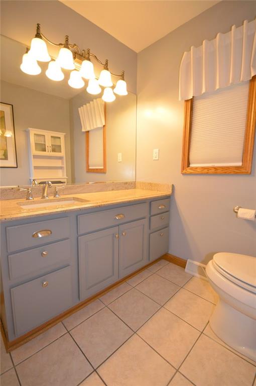 2610 Pulaski Road New Castle, PA 16105 - Photo 15 of 25 Shared main floor bath has an oversized vanity with granite countertops, tile floors and tub/shower combo.