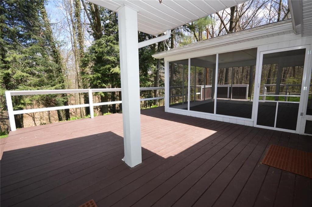 2610 Pulaski Road New Castle, PA 16105 - Photo 19 of 25 Rear deck faces beautiful wooded lot with stream and is a great place to relax.