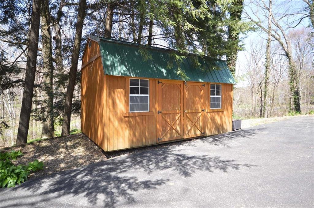 2610 Pulaski Road New Castle, PA 16105 - Photo 24 of 25 Storage shed can hold overflow items, freeing up space in the 3+ car garage.
