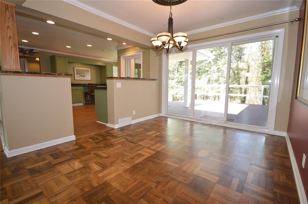 2610 Pulaski Road New Castle, PA 16105 - Photo 5 of 25 The large dining room adjoins the kitchen and living room and has easy access to the rear deck.