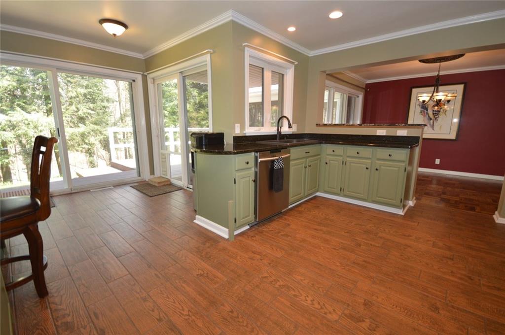 2610 Pulaski Road New Castle, PA 16105 - Photo 8 of 25 Breakfast nook with multiple sliding doors is easily accessible to the rear deck.