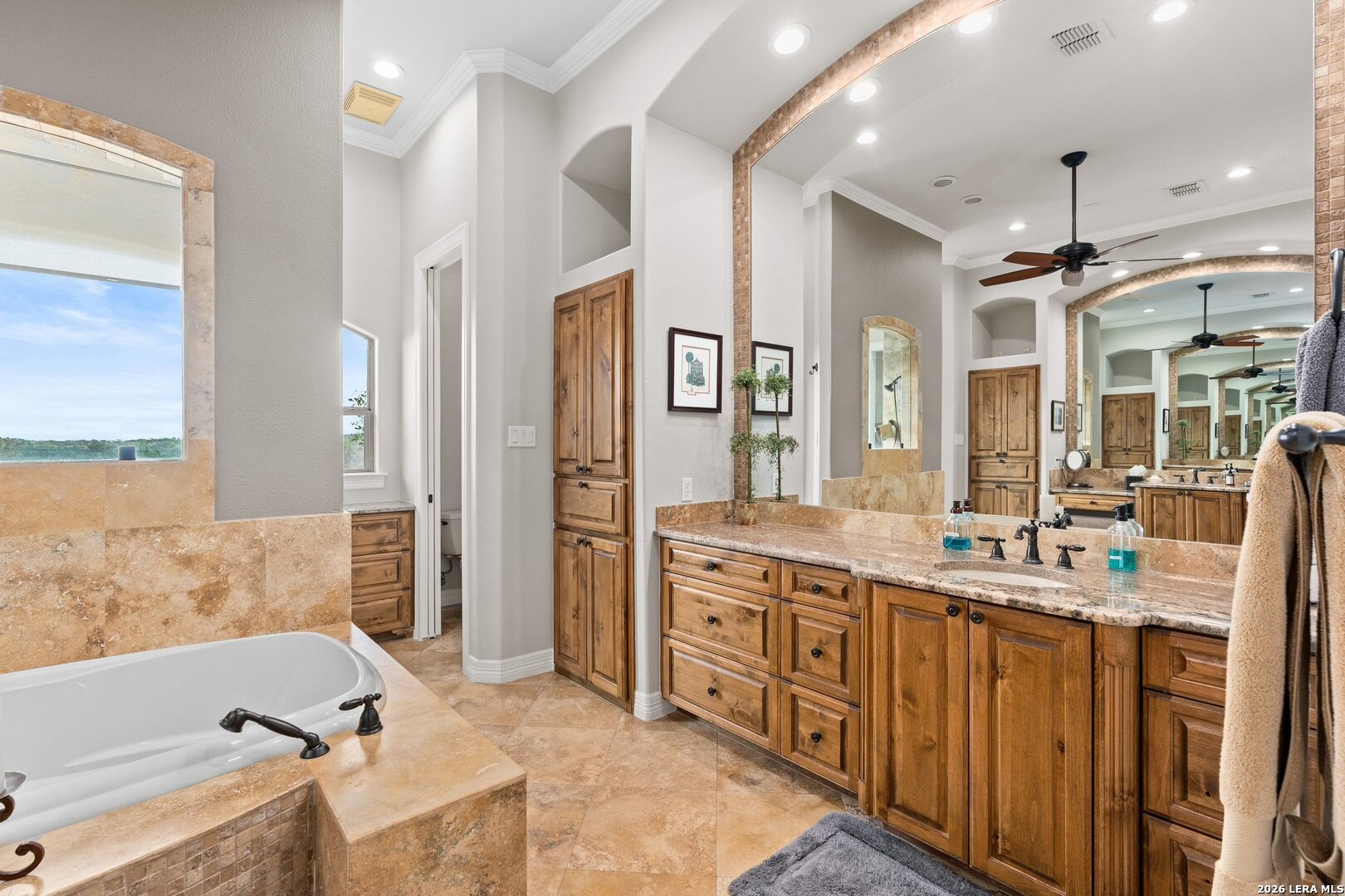 136 Park Ridge Boerne, TX 78006 - Photo 23 of 47 a bathroom with a tub sink double vanity granite tub shower and mirror