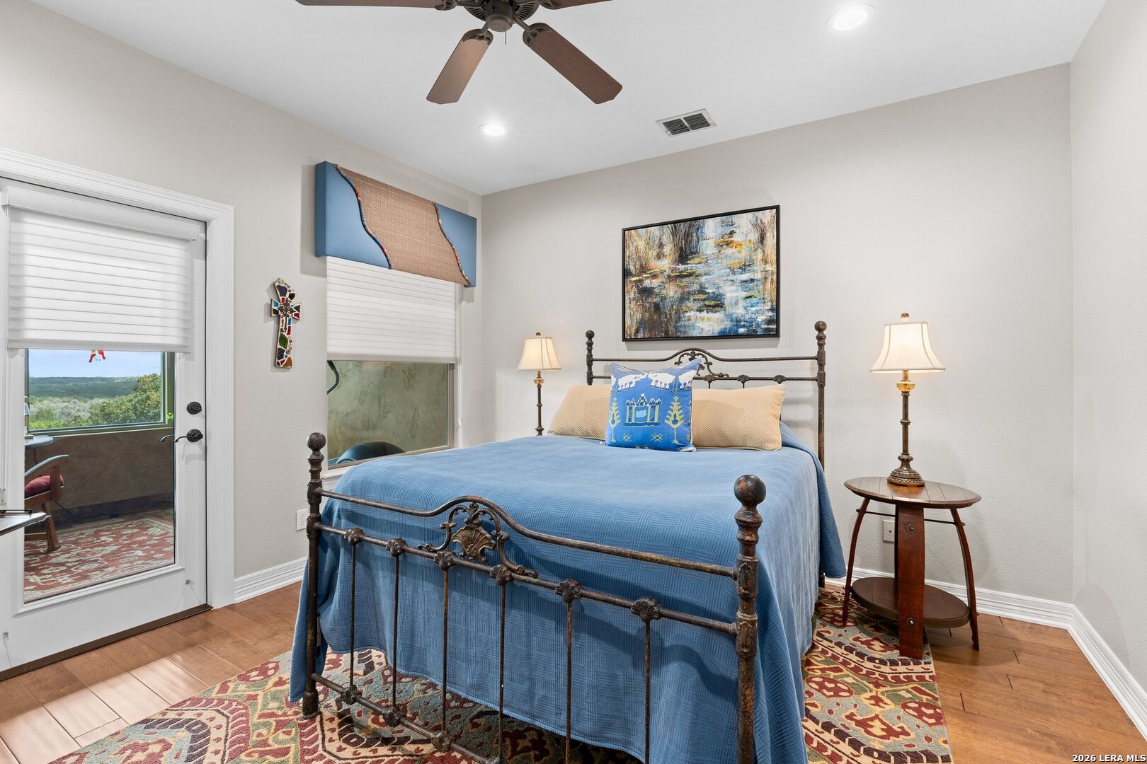 136 Park Ridge Boerne, TX 78006 - Photo 33 of 47 a bed room with furniture and a chandelier
