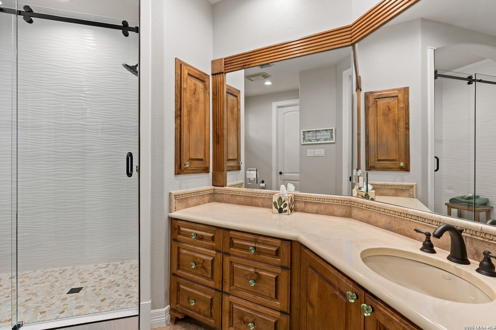 136 Park Ridge Boerne, TX 78006 - Photo 34 of 47 a bathroom with a granite countertop sink mirror and double