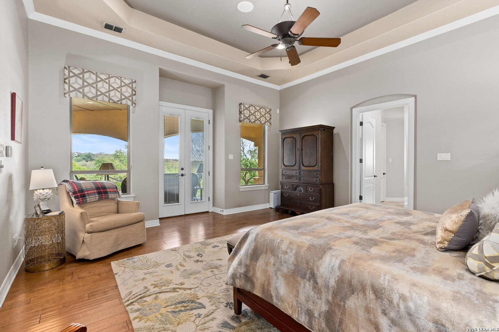 136 Park Ridge Boerne, TX 78006 - Photo 35 of 47 a spacious bedroom with a bed a couch and a window