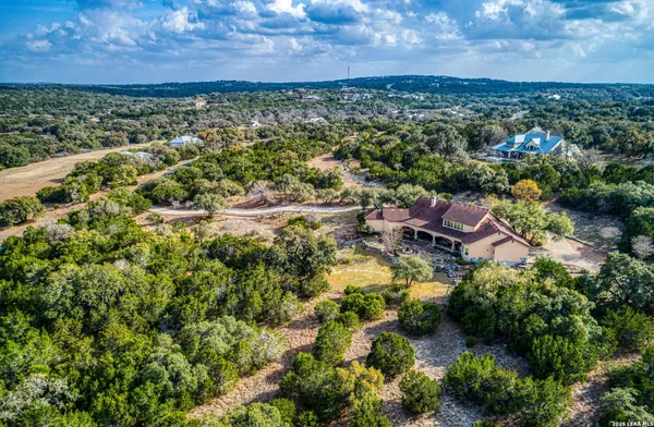an aerial view of a house with a garden