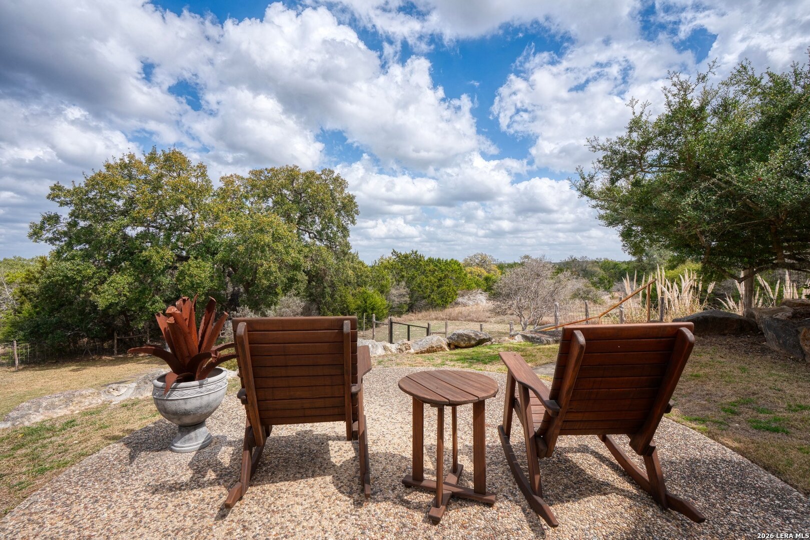 136 Park Ridge Boerne, TX 78006 - Photo 47 of 47 a view of a chairs and table in the backyard