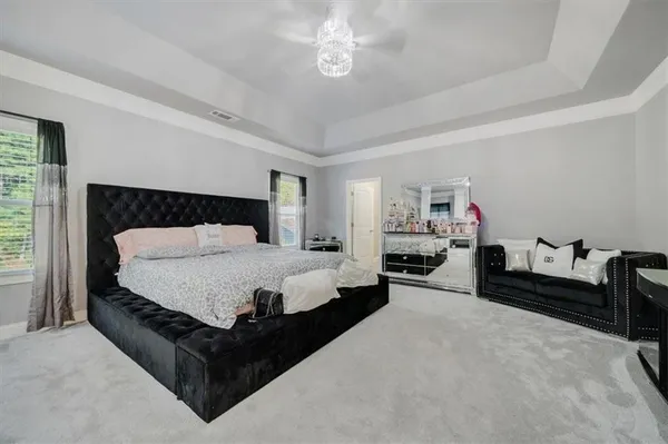 a bed room with a bed and furniture