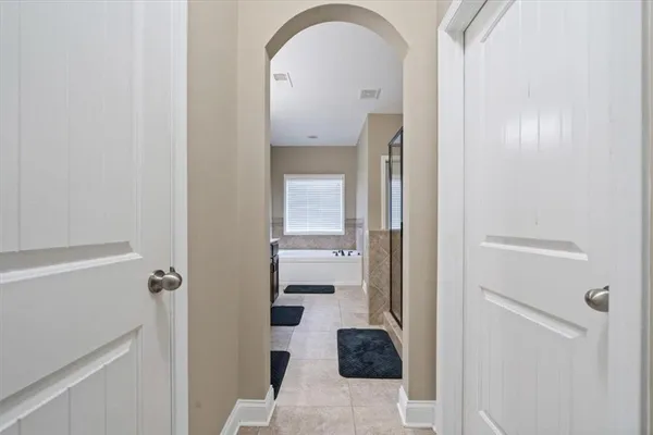 a view of a bathroom from a hallway