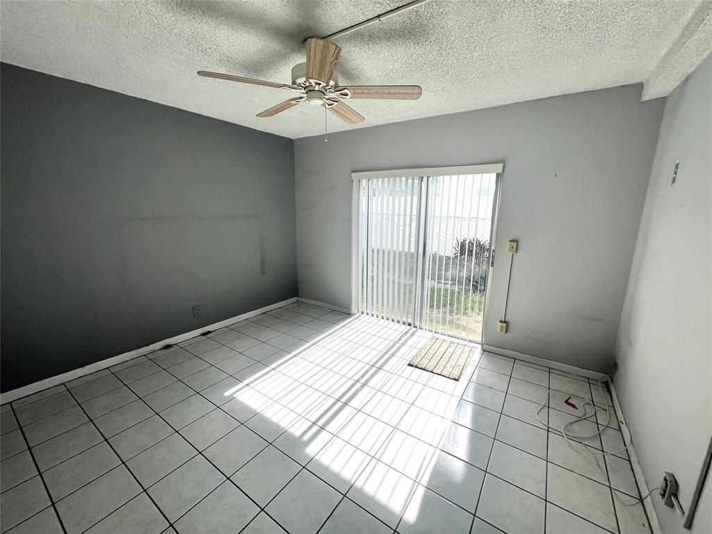 751 Pine Drive, Unit 103 Pompano Beach, FL 33060 - Photo 12 of 18 a view of an empty room and window