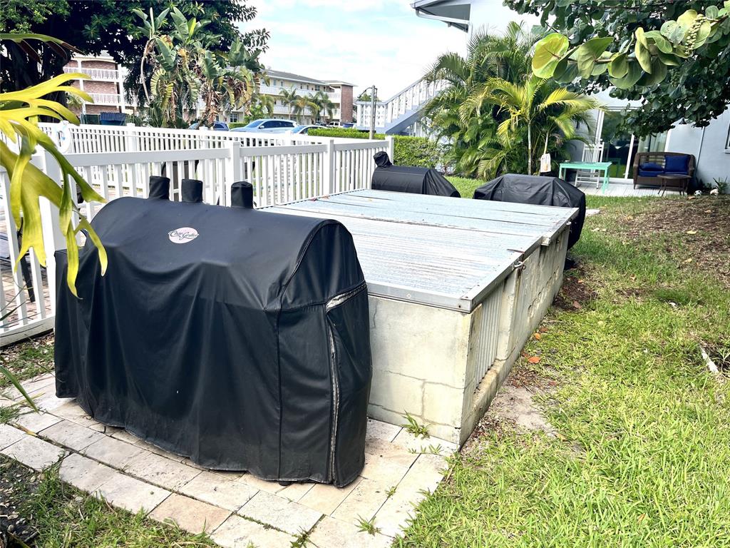 751 Pine Drive, Unit 103 Pompano Beach, FL 33060 - Photo 17 of 18 a view of outdoor space yard and patio