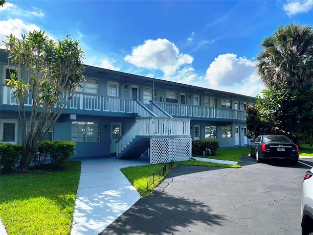 a view of a car park in front of house