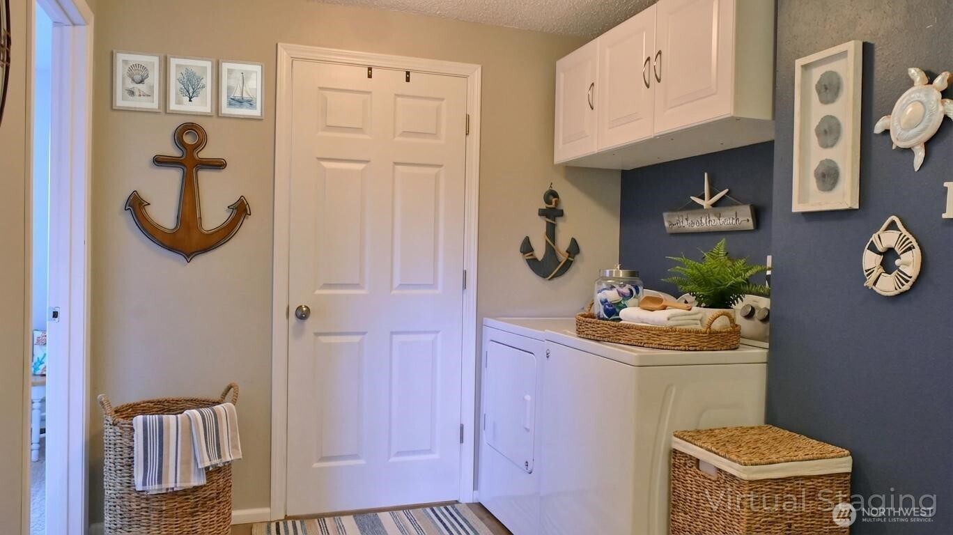 35102 H Place Ocean Park, WA 98640 - Photo 11 of 14 a bathroom with a sink a toilet and shower curtain