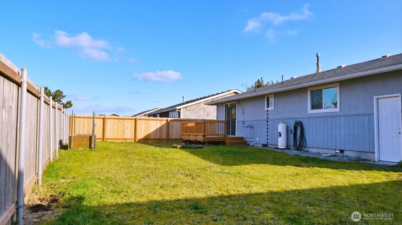 35102 H Place Ocean Park, WA 98640 - Photo 13 of 14 a view of a house with a yard and garage