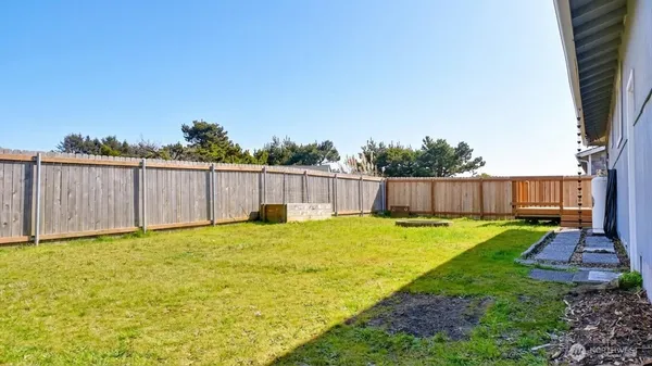 a swimming pool with wooden fence
