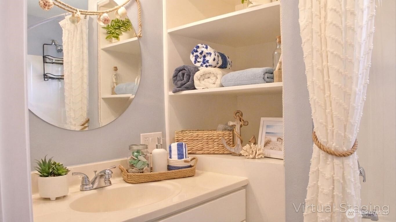35102 H Place Ocean Park, WA 98640 - Photo 9 of 14 a bathroom with a sink and a mirror